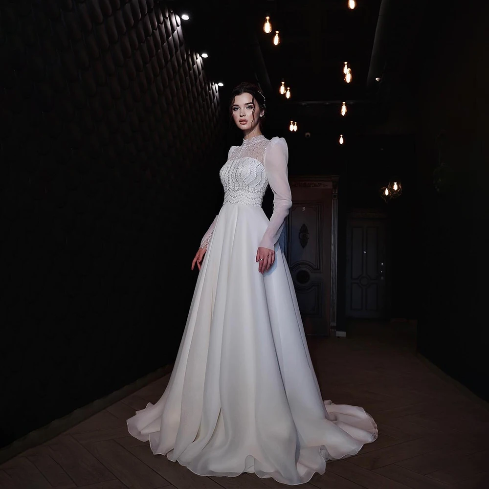 Exquisite Wedding Dresses High Neck Long Sleeve Bride Dress with Beading Sequined A-Line Bridal Gown Customized robe de mariée
Exquisite Wedding Dresses High Neck Long Sleeve Bride Dress with Beading Sequined A-Line Bridal Gown Customized robe de mariée