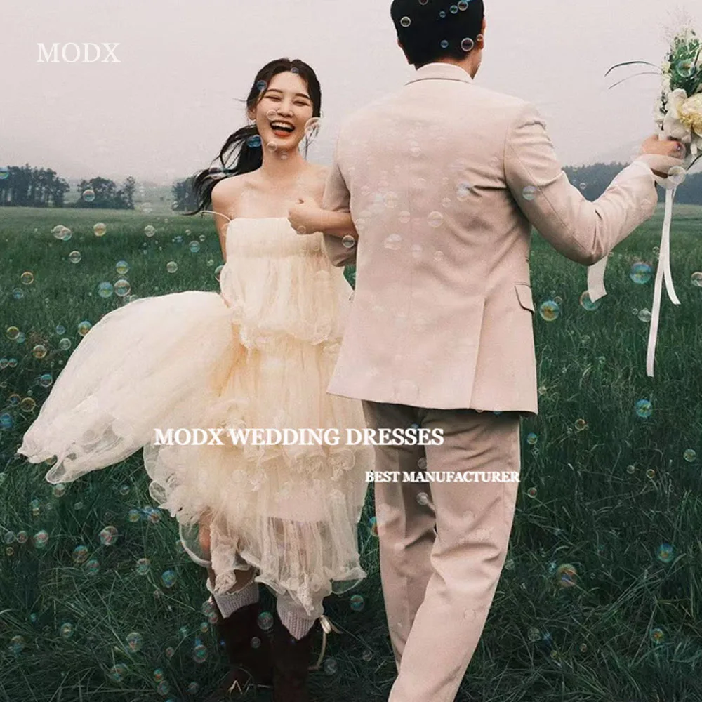 MODX Fairy Tiered Tulle Wedding Dresses Korea Photo shoot Strapless Princess Country Bride Gowns Corset Back Evening Dress
MODX Fairy Tiered Tulle Wedding Dresses Korea Photo shoot Strapless Princess Country Bride Gowns Corset Back Evening Dress