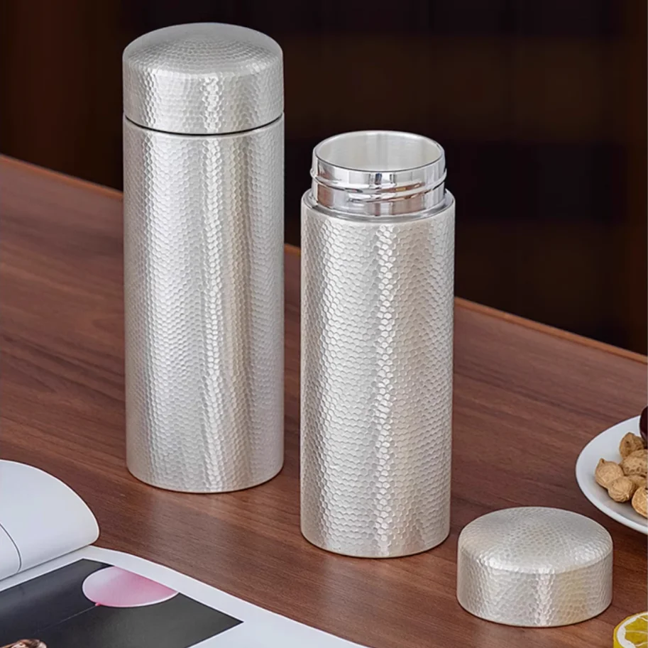 999 Sterling Silver Travel Bottle Portable Thermos with Filter Straight Water Cup Hammer Pattern for Health And Business Gifts
999 Sterling Silver Travel Bottle Portable Thermos with Filter Straight Water Cup Hammer Pattern for Health And Business Gifts