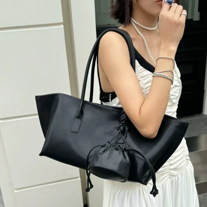 Women's Genuine Leather Tote Bag With Drawstring Pouch High Quality Batwing Shape Handbag Large Capacity Minimalist Shoulder Bag
Women's Genuine Leather Tote Bag With Drawstring Pouch High Quality Batwing Shape Handbag Large Capacity Minimalist Shoulder Bag