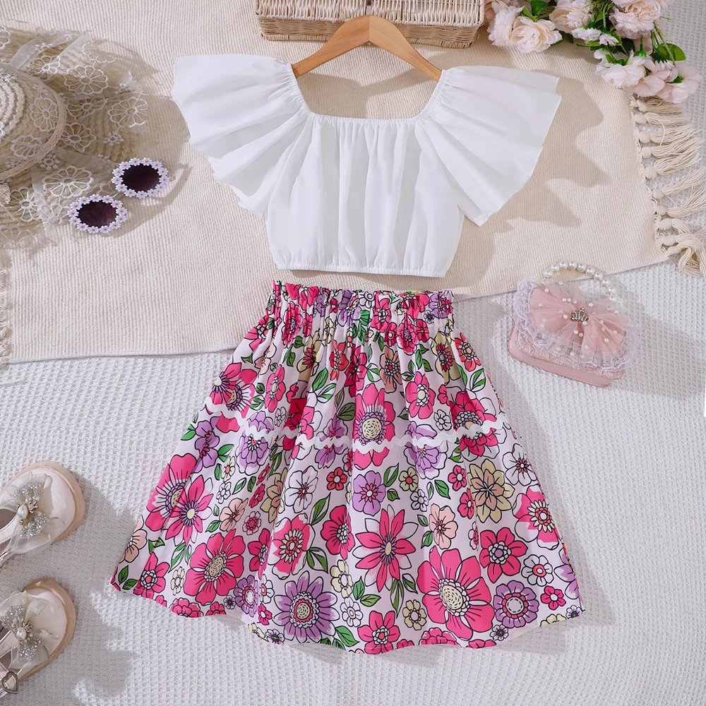 Girls' spring and summer new ruffled top with floral print short skirt two-piece casual set
Girls' spring and summer new ruffled top with floral print short skirt two-piece casual set