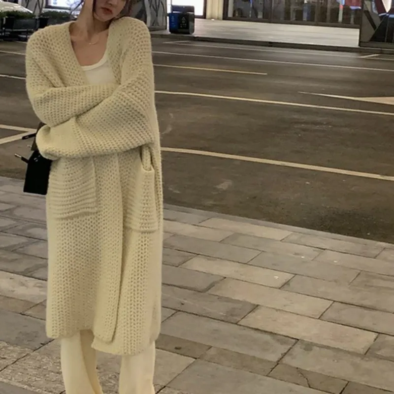 Korean V-neck Knitted Sweater Women's Solid Color New Autumn Loose Large Pocket Coat Casual Mid-Long Sleeve Knitting Cardigan
Korean V-neck Knitted Sweater Women's Solid Color New Autumn Loose Large Pocket Coat Casual Mid-Long Sleeve Knitting Cardigan