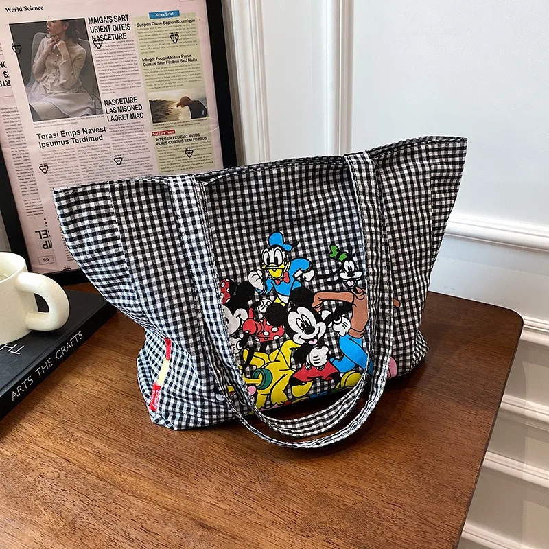 New Disney Canvas Bag Female Black and White Plaid Shoulder Tote Bag Cute Cartoon Handheld Shopping Bag
New Disney Canvas Bag Female Black and White Plaid Shoulder Tote Bag Cute Cartoon Handheld Shopping Bag