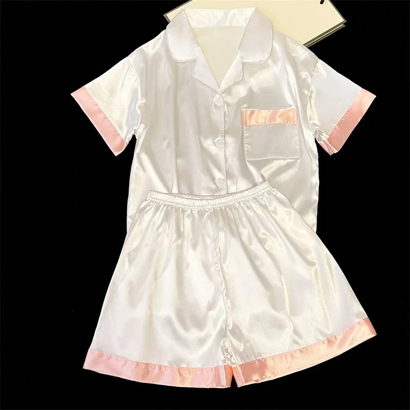 Ice silk thin section simple white ladies pajamas summer 2025 new short-sleeved shorts lapel girls homewear two-piece suit
Ice silk thin section simple white ladies pajamas summer 2025 new short-sleeved shorts lapel girls homewear two-piece suit