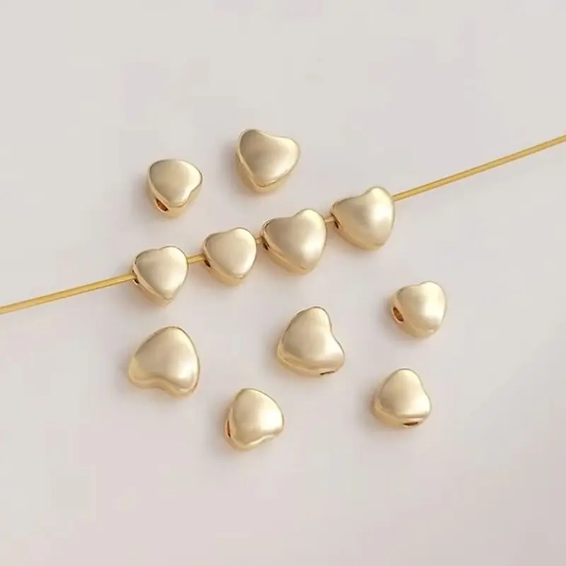 14K bag gold color double curved face peach heart bead heart scattered beads handmade DIY bracelet earrings jewelry with beads
14K bag gold color double curved face peach heart bead heart scattered beads handmade DIY bracelet earrings jewelry with beads