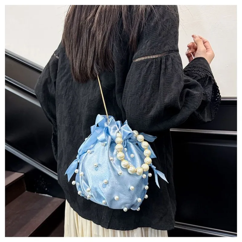 Niche Pearl Hand Bag Women's 2026 New Versatile Literary Shoulder Cloth Bag Chain Crossbody Drawstring Bucket Bag Temperament
Niche Pearl Hand Bag Women's 2026 New Versatile Literary Shoulder Cloth Bag Chain Crossbody Drawstring Bucket Bag Temperament