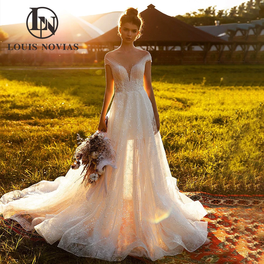 LOUIS NOVIAS Свадебное платье трапециевидной формы с открытыми плечами, потрясающее свадебное платье с иллюзией и блестками, глубоким v-образным вырезом и открытой спиной, Vestidos De Novia
LOUIS NOVIAS Свадебное платье трапециевидной формы с открытыми плечами, потрясающее свадебное платье с иллюзией и блестками, глубоким v-образным вырезом и открытой спиной, Vestidos De Novia