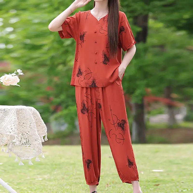 Women's New Style Spliced round Neck Button Printed Loose Short-sleeved Top Elastic High Waist Pocket Tying Pants Suit
Women's New Style Spliced round Neck Button Printed Loose Short-sleeved Top Elastic High Waist Pocket Tying Pants Suit