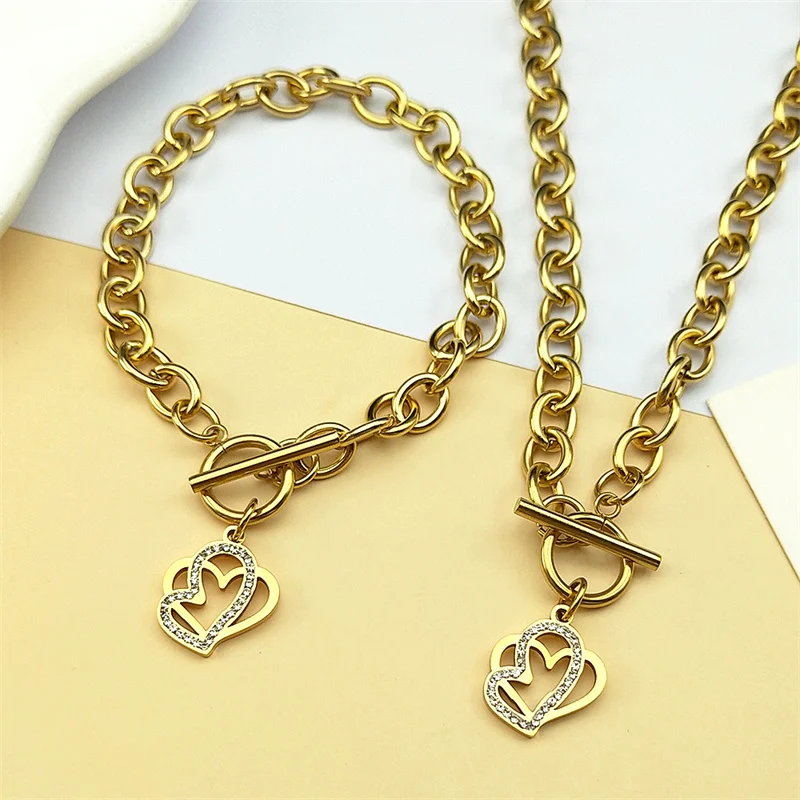 Fashion White Rhinestone Double Heart Shape Pendant Jewelry Sets Women Men Stainless Steel Gold Color Necklace Bracelet Set Gift
Fashion White Rhinestone Double Heart Shape Pendant Jewelry Sets Women Men Stainless Steel Gold Color Necklace Bracelet Set Gift