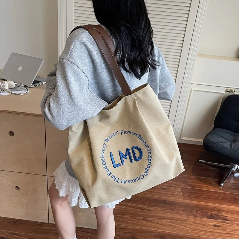 Korean Large Canvas Tote Bag for Women Fashionable Shopper Bag with Shoulder Strap High Quality Handheld Book Bag for Students
Korean Large Canvas Tote Bag for Women Fashionable Shopper Bag with Shoulder Strap High Quality Handheld Book Bag for Students