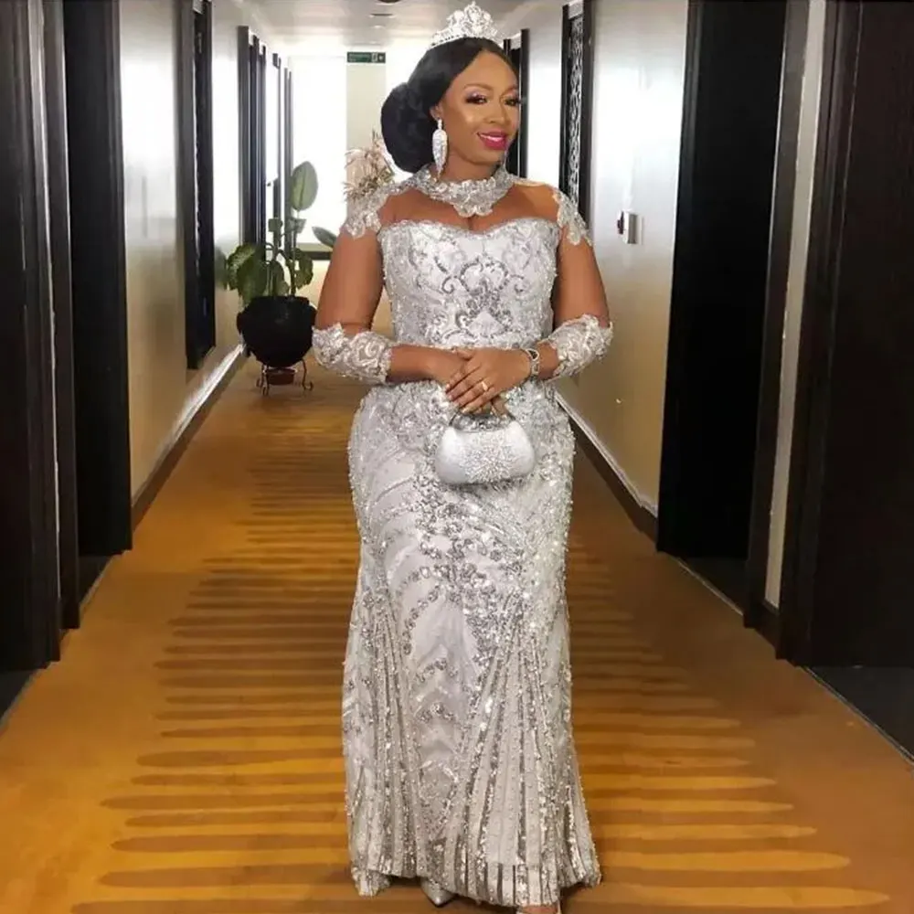 Африканский стиль Aso Ebi Серебряные вечерние платья Женские вечерние платья Кружева с бисером Русалка Вечернее платье для особых случаев Иллюзия Длинное Sl
Африканский стиль Aso Ebi Серебряные вечерние платья Женские вечерние платья Кружева с бисером Русалка Вечернее платье для особых случаев Иллюзия Длинное Sl