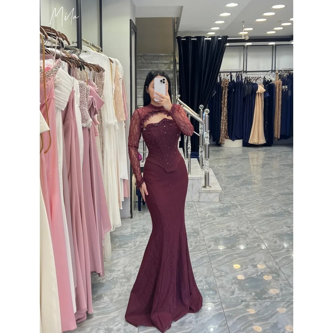 Вечернее платье Mila Burgundy с кружевным чокером, вырезами, длинными рукавами, отделкой стразами, индивидуальный пошив, фасон «русалка», для выпускного вечера, vestidos de gala
Вечернее платье Mila Burgundy с кружевным чокером, вырезами, длинными рукавами, отделкой стразами, индивидуальный пошив, фасон «русалка», для выпускного вечера, vestidos de gala