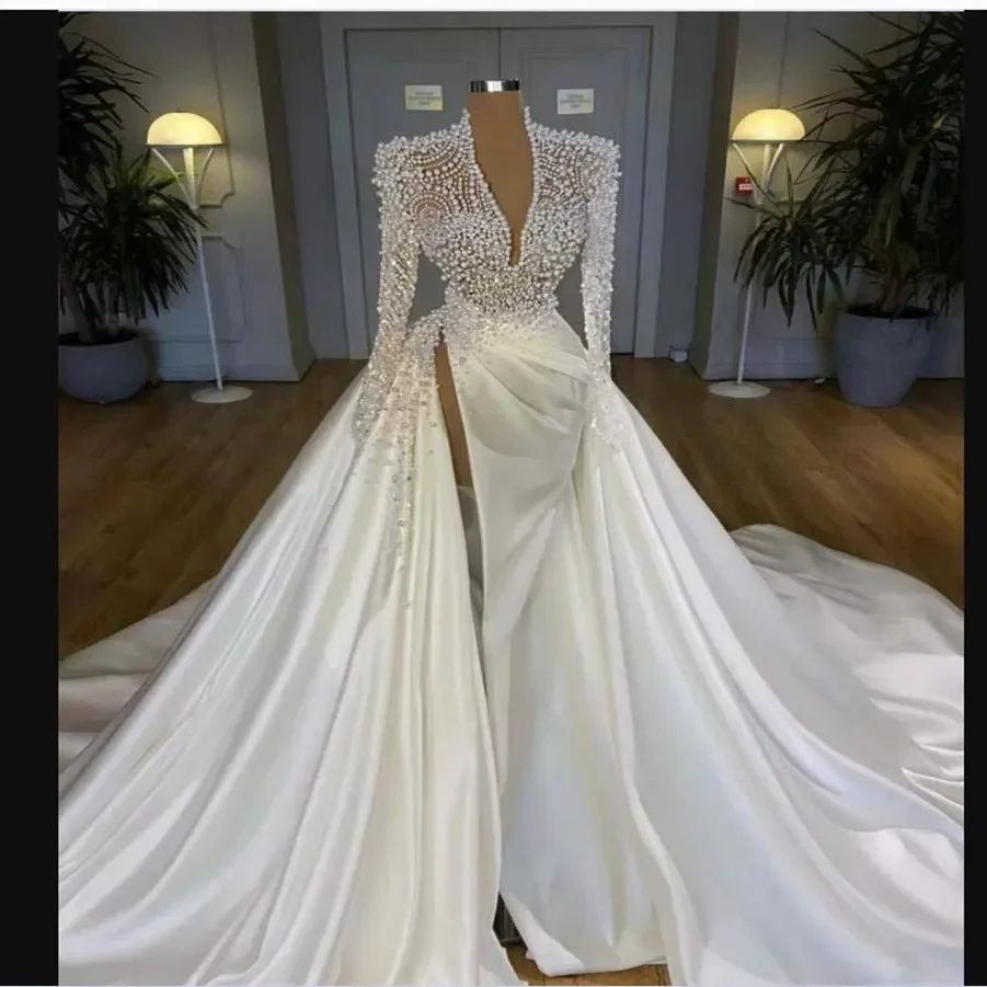 Сексуальное свадебное платье ручной работы с v-образным вырезом и жемчугом русалки с длинным рукавом, свадебное платье трапециевидной формы со съемным шлейфом и высоким разрезом по индивидуальному заказу
Сексуальное свадебное платье ручной работы с v-образным вырезом и жемчугом русалки с длинным рукавом, свадебное платье трапециевидной формы со съемным шлейфом и высоким разрезом по индивидуальному заказу