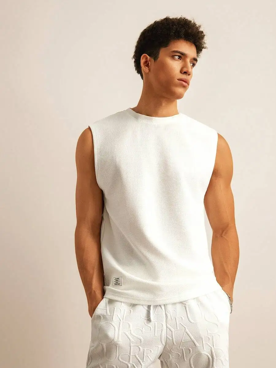 Men's White Textured Sleeveless Tank Top with Waffle Knit Design
Men's White Textured Sleeveless Tank Top with Waffle Knit Design