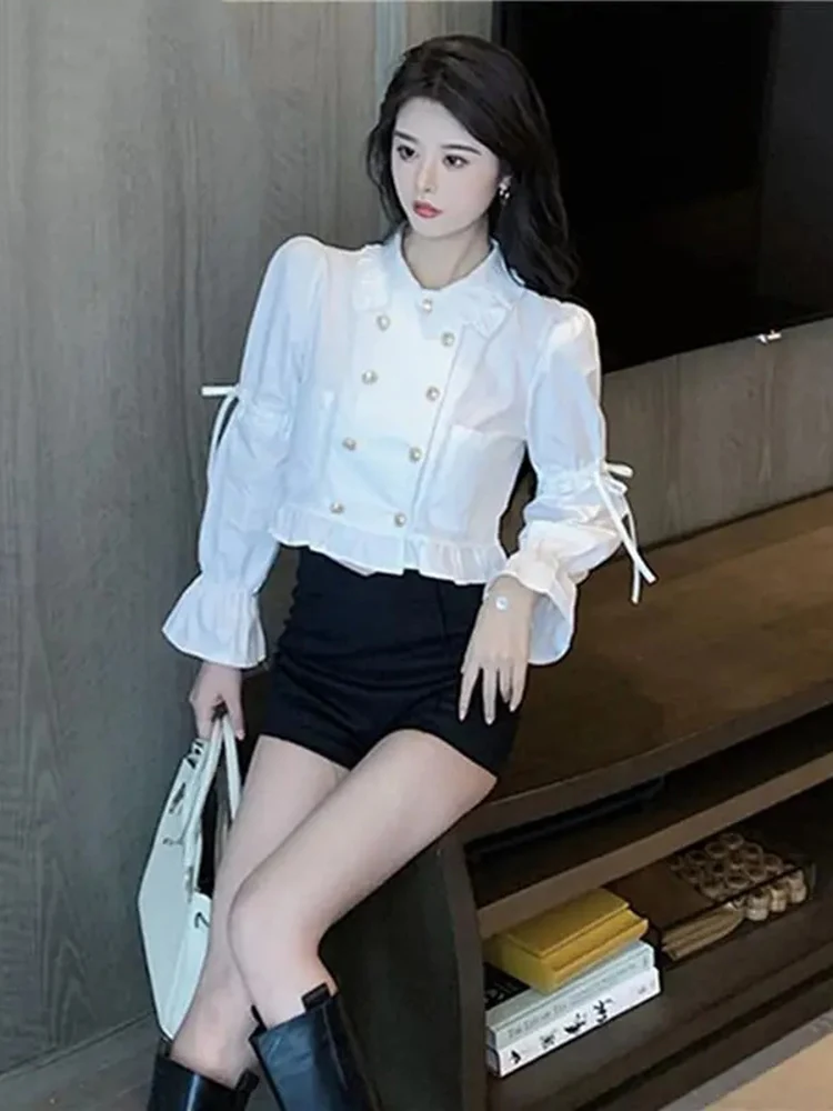 Белые рубашки, женские двубортные блузки с длинными рукавами во французском дворцовом стиле, модные короткие топы с расклешенными рукавами и карманами
Белые рубашки, женские двубортные блузки с длинными рукавами во французском дворцовом стиле, модные короткие топы с расклешенными рукавами и карманами