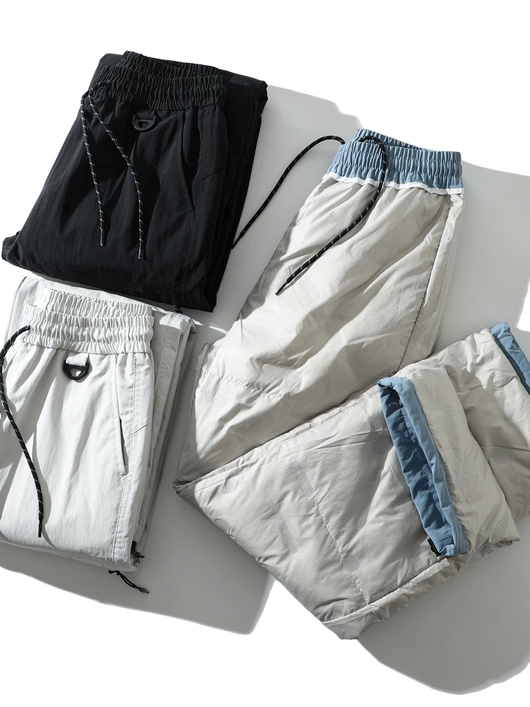 Мужские повседневные прямые брюки с наполнителем, ветрозащитные, 90% пух, длинные, модные, городские, для активного отдыха, зимняя коллекция
Мужские повседневные прямые брюки с наполнителем, ветрозащитные, 90% пух, длинные, модные, городские, для активного отдыха, зимняя коллекция