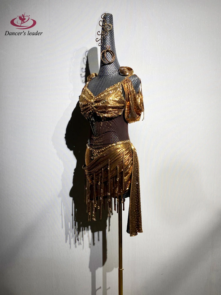 Латинская танцовщица для взрослых и детей, высококачественное золотое платье по индивидуальному заказу, танго, самба, AB, платье для выступлений с камнями
Латинская танцовщица для взрослых и детей, высококачественное золотое платье по индивидуальному заказу, танго, самба, AB, платье для выступлений с камнями