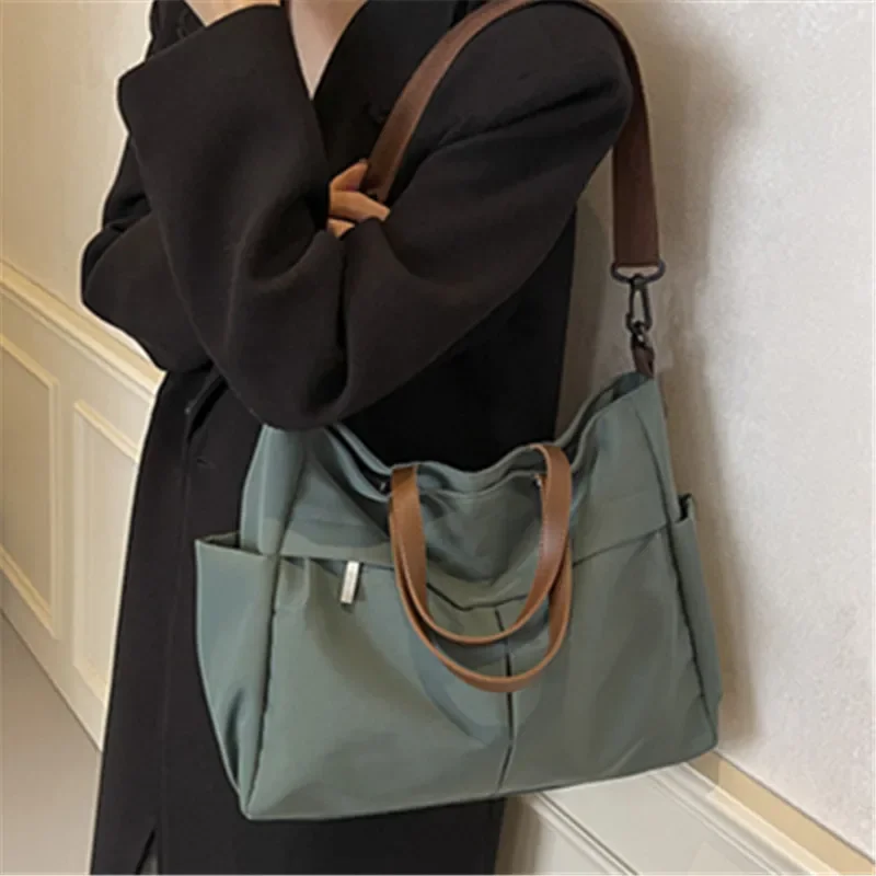 Spacious Nylon Tote Bag for Women Stylish Handbag Shoulder Crossbody Bag, Perfect for Outings Travel, Business, Fitness Shopping
Spacious Nylon Tote Bag for Women Stylish Handbag Shoulder Crossbody Bag, Perfect for Outings Travel, Business, Fitness Shopping