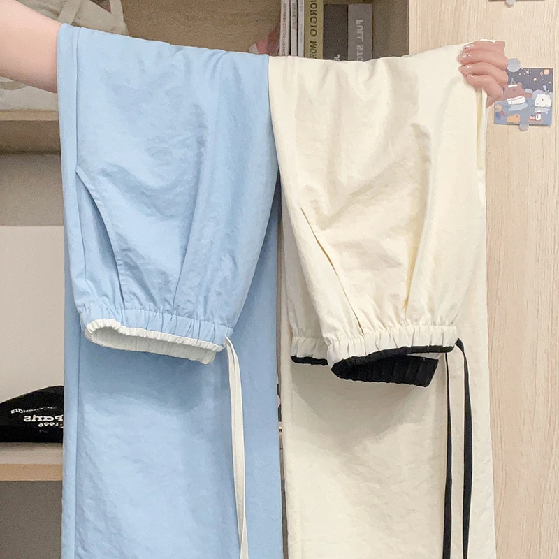 White wide leg pants for women's spring and summer patchwork contrasting loose straight leg ice sports pants
White wide leg pants for women's spring and summer patchwork contrasting loose straight leg ice sports pants