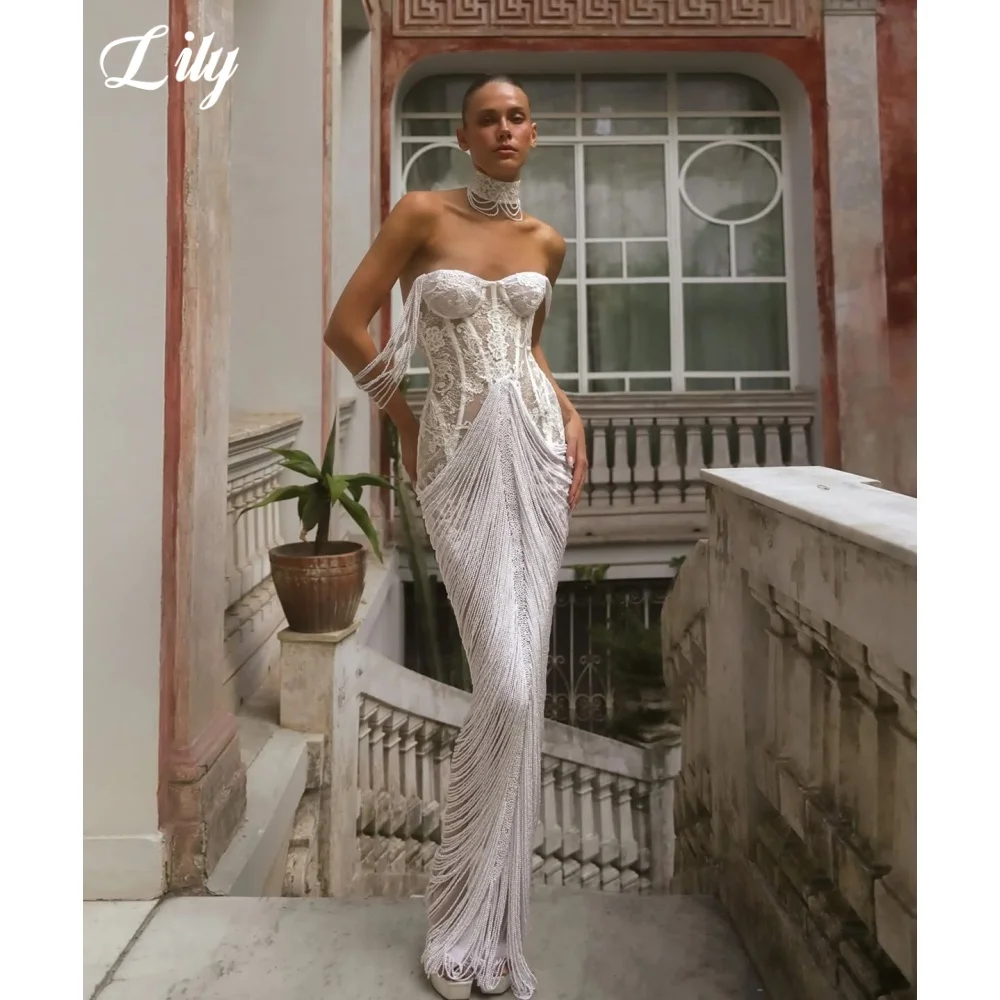 Lily Luxury White Strapless Lace Prom Dress Corset Evening Dress with Beaded Fringe Mermaid Skirt فساتين مناسبة رسمية Customized
Lily Luxury White Strapless Lace Prom Dress Corset Evening Dress with Beaded Fringe Mermaid Skirt فساتين مناسبة رسمية Customized