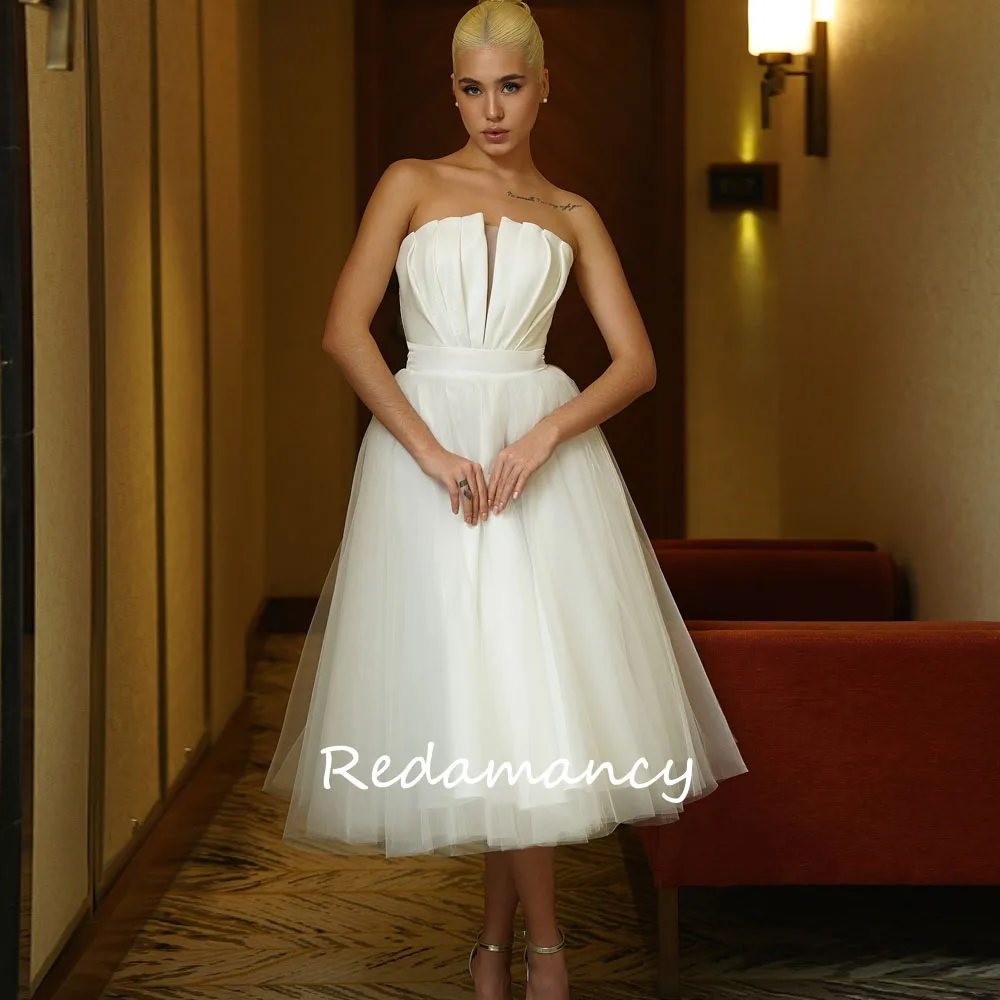 Redamancy Customized Ivory Strapless Tulle Wedding Dress 2025 Backless Lace Up A-Line Party Dress Tea-Length vestidos de novia
Redamancy Customized Ivory Strapless Tulle Wedding Dress 2025 Backless Lace Up A-Line Party Dress Tea-Length vestidos de novia