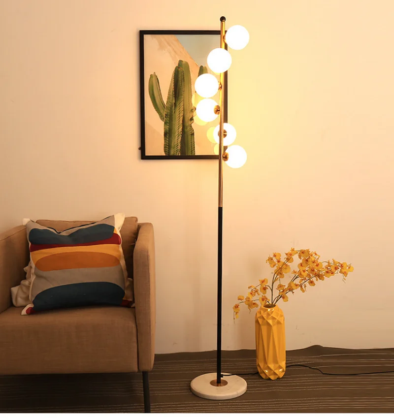 Nordic living room bedroom headboard creative personality glass ball post-modern floor standing lamp
Nordic living room bedroom headboard creative personality glass ball post-modern floor standing lamp
