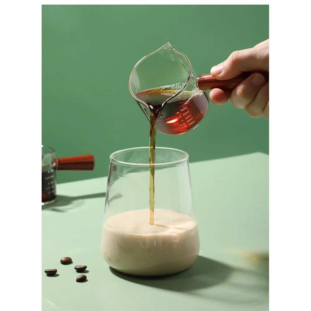 75ml Borosilicate Glass Coffee Cup with Dual Spout and Wooden Handle Including Measurement Scale for Espresso and Milk Pouring
75ml Borosilicate Glass Coffee Cup with Dual Spout and Wooden Handle Including Measurement Scale for Espresso and Milk Pouring