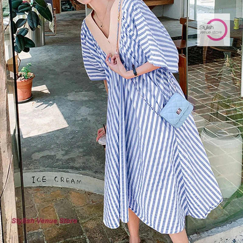 Summer fashion casual V-neck pink striped dress female Korean new loose belly-covering slim first and long over-the-knee skirt. 
Summer fashion casual V-neck pink striped dress female Korean new loose belly-covering slim first and long over-the-knee skirt.