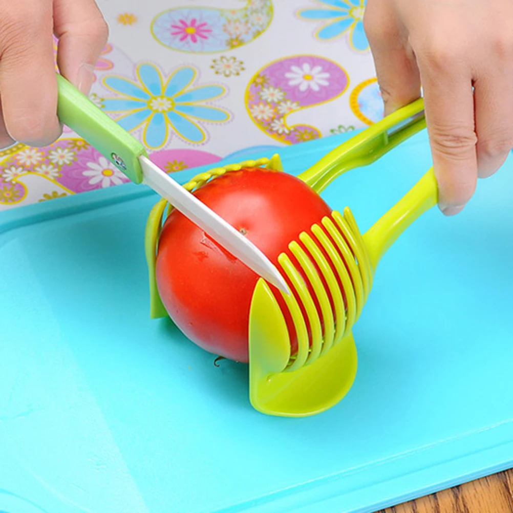 Multi-Purpose Round Tomato Slicer Lemon Cutter Plastic Fruits Tongs Onion Holder Kitchen Cutting Aid German Design Safety Clamp 
Multi-Purpose Round Tomato Slicer Lemon Cutter Plastic Fruits Tongs Onion Holder Kitchen Cutting Aid German Design Safety Clamp
