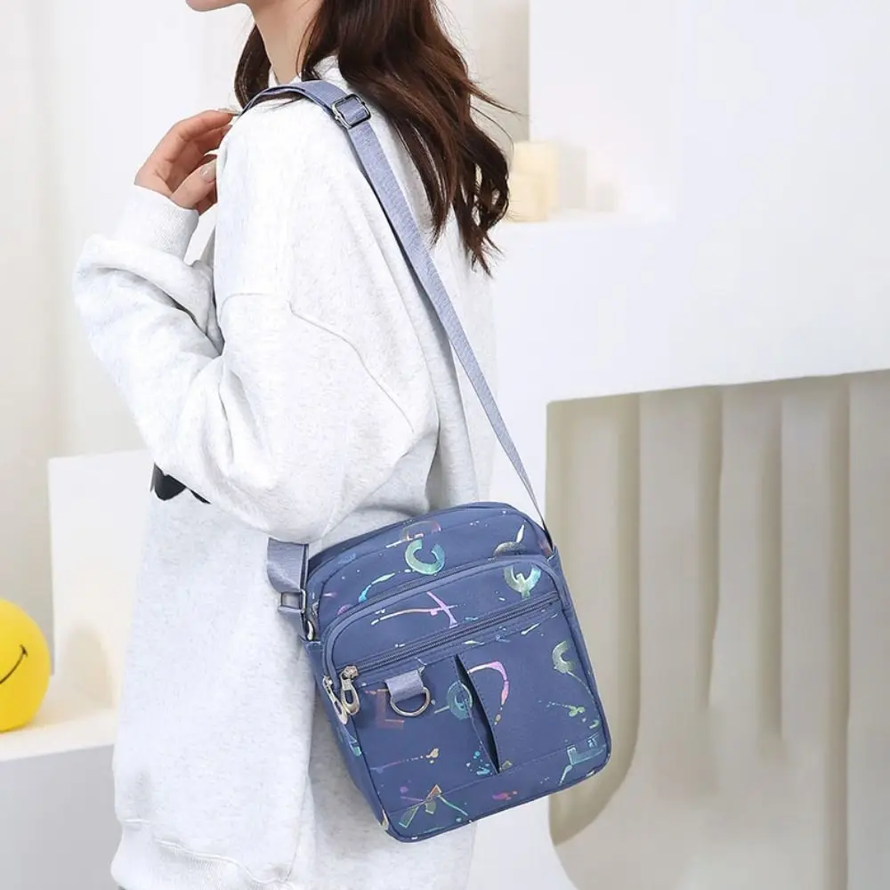 Multi-layer Multi Pocket Nylon Shoulder Bag Lightweight Leisure Mobile Phone Bag Waterproof Printing Casual Crossbody Bag Women
Multi-layer Multi Pocket Nylon Shoulder Bag Lightweight Leisure Mobile Phone Bag Waterproof Printing Casual Crossbody Bag Women
