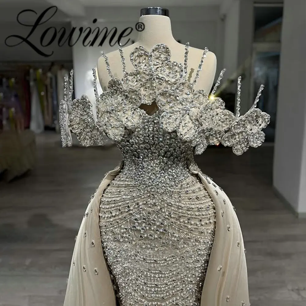 Arabic Sparkly Crystals Beaded Off Shoulder Evening Dresses with Overskirt 2026 Elegant Formal Wedding Party Gowns Customized
Arabic Sparkly Crystals Beaded Off Shoulder Evening Dresses with Overskirt 2026 Elegant Formal Wedding Party Gowns Customized
