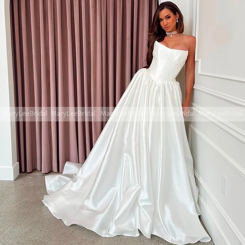 Свадебное платье трапециевидной формы без бретелек по индивидуальному заказу, объемная юбка принцессы, белое атласное платье цвета слоновой кости с баской на талии, свадебные платья, платья de novia
Свадебное платье трапециевидной формы без бретелек по индивидуальному заказу, объемная юбка принцессы, белое атласное платье цвета слоновой кости с баской на талии, свадебные платья, платья de novia