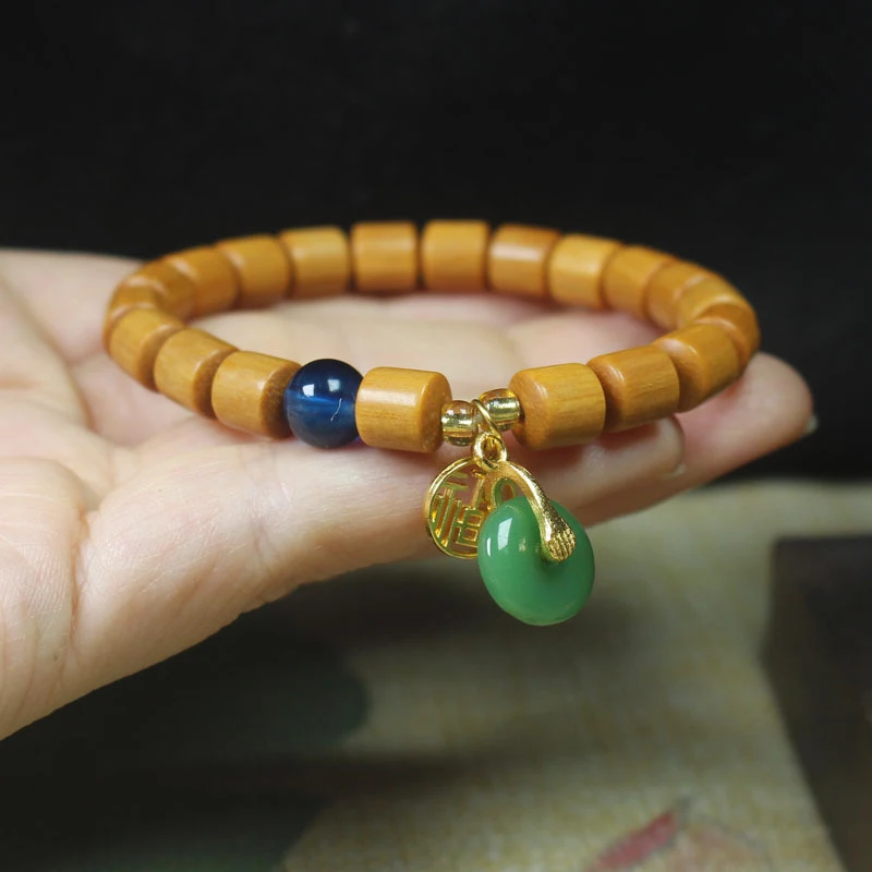Sandalwood barrel bead bracelet with fortune charm and peace pendant, forest-style wooden Buddhist prayer beads jewelry
Sandalwood barrel bead bracelet with fortune charm and peace pendant, forest-style wooden Buddhist prayer beads jewelry