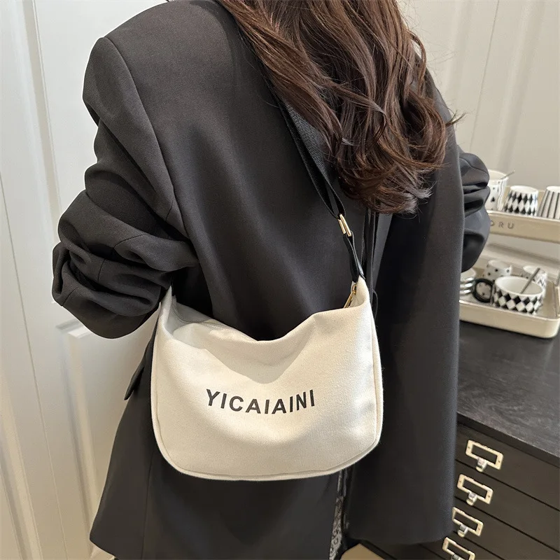 Letter printed new casual solid color simple and lightweight 2026 popular canvas shoulder dumpling tote bag
Letter printed new casual solid color simple and lightweight 2026 popular canvas shoulder dumpling tote bag