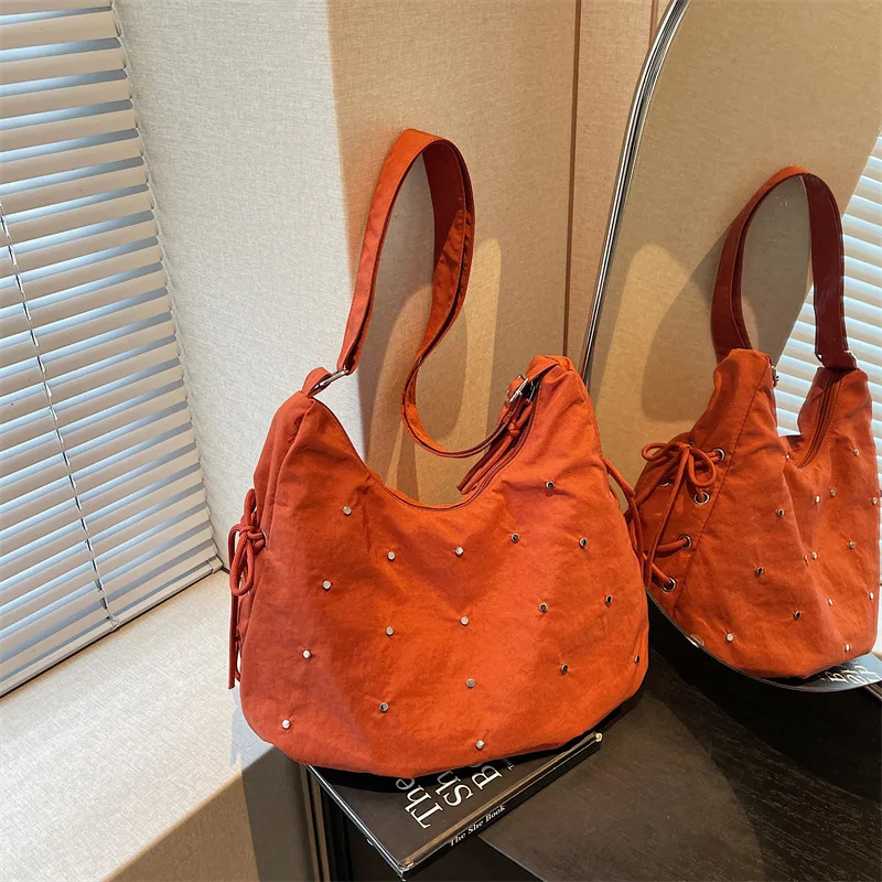 Lightweight Large Capacity Shoulder Crossbody Bag Women Rivet Nylon Tote Bag Niche Versatile Student Commuting Underarm Bag
Lightweight Large Capacity Shoulder Crossbody Bag Women Rivet Nylon Tote Bag Niche Versatile Student Commuting Underarm Bag