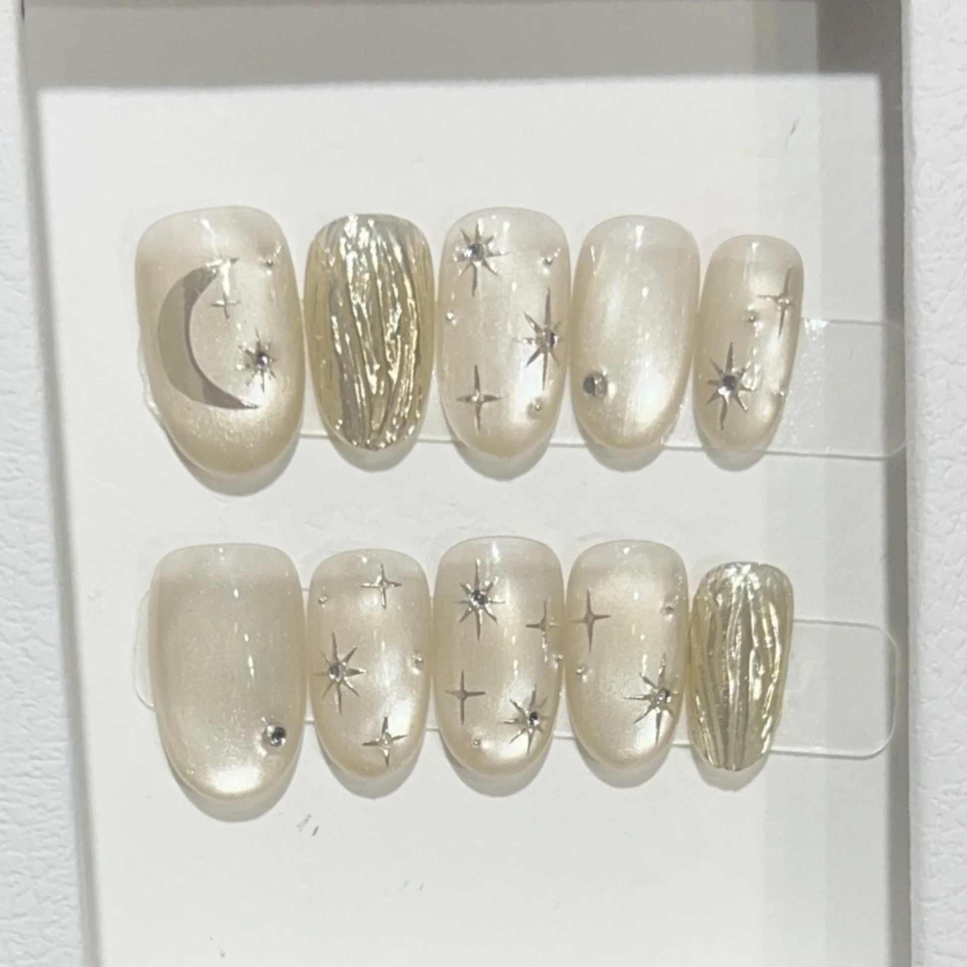 10pcs Short Oval Handmade Press on Nails Sets Cat's Eye Full Cover Nail Tips Moon Star Design False Nail Art Wearable Fake Nails
10pcs Short Oval Handmade Press on Nails Sets Cat's Eye Full Cover Nail Tips Moon Star Design False Nail Art Wearable Fake Nails