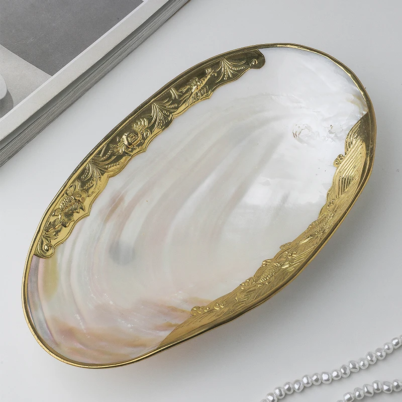 light luxury inlaid gold-edged clam shell decorative fruit plate, living room dining table top ornament, jewelry storage tray
light luxury inlaid gold-edged clam shell decorative fruit plate, living room dining table top ornament, jewelry storage tray