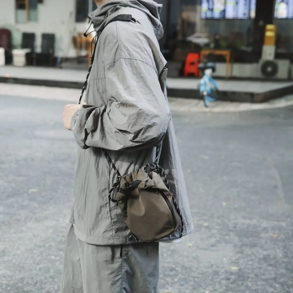 Korean Style Drawstring Bucket Bag Handbag Solid Color Nylon Shoulder Bag Adjustable Shoulder Strap Purse Small Crossbody Bag
Korean Style Drawstring Bucket Bag Handbag Solid Color Nylon Shoulder Bag Adjustable Shoulder Strap Purse Small Crossbody Bag