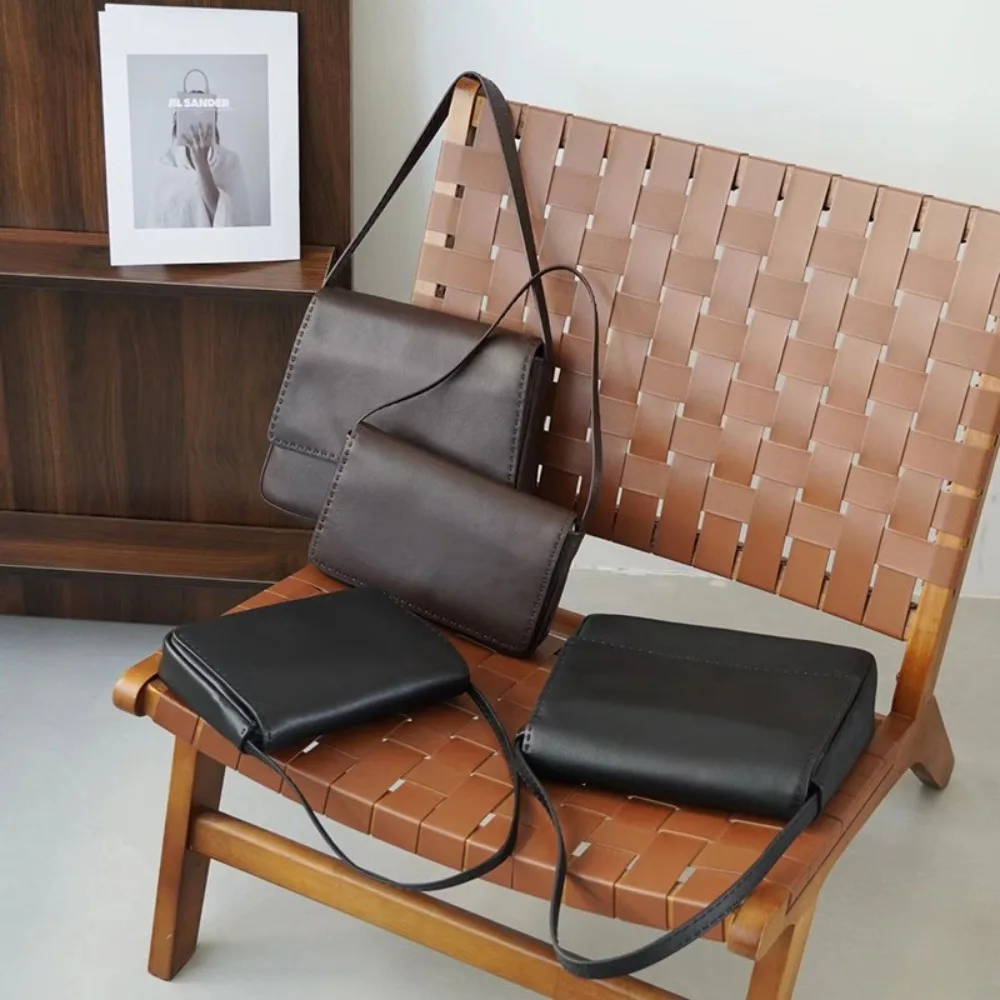 Высококачественная внутри и снаружи, минималистичная сумка-бродяга из овчины с ручной строчкой, простая свободная сумка для ленивых подмышек
Высококачественная внутри и снаружи, минималистичная сумка-бродяга из овчины с ручной строчкой, простая свободная сумка для ленивых подмышек