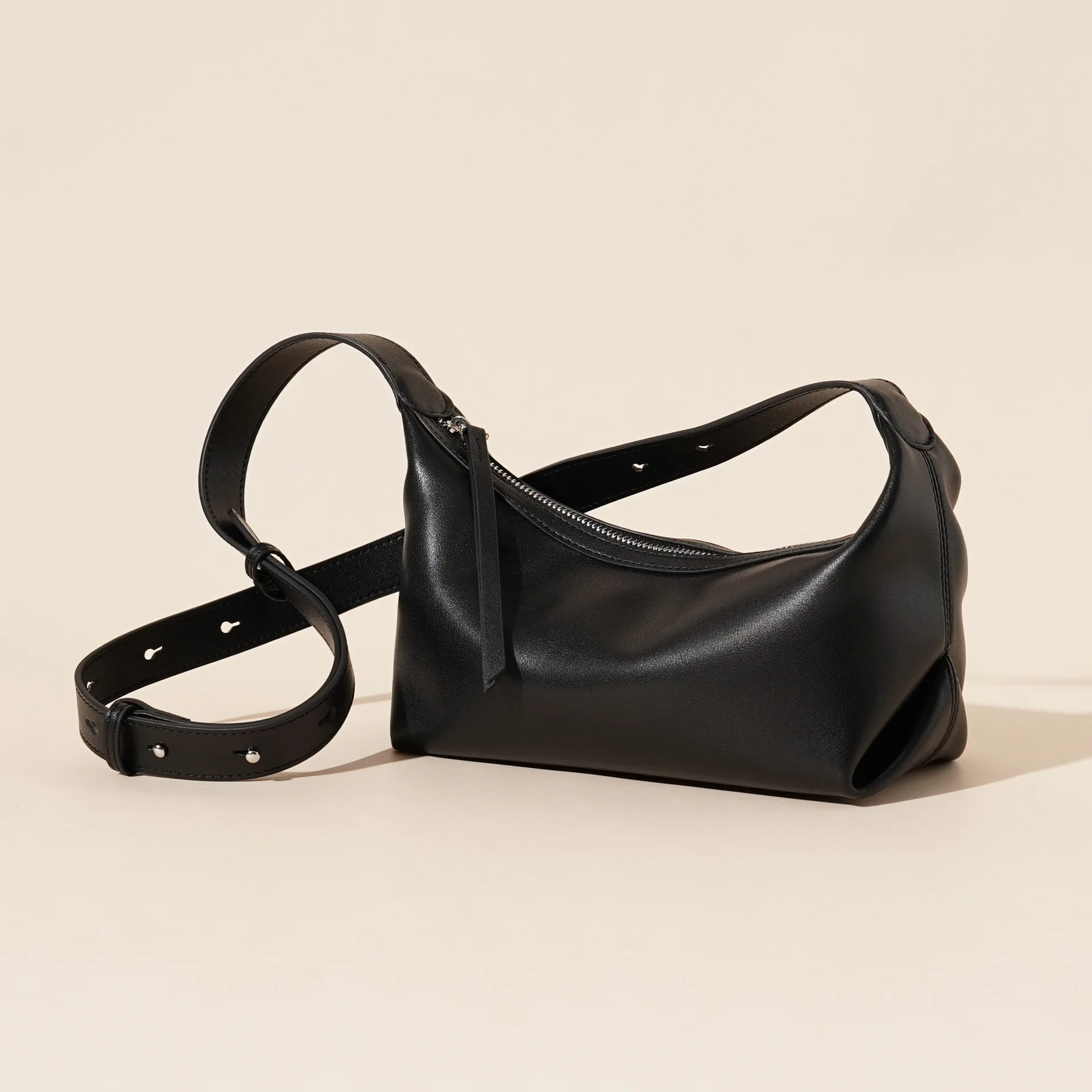 The new 'It' Bag. Make a stylish statement with this chic dumpling bag in premium leather. Underarm or crossbody.
The new 'It' Bag. Make a stylish statement with this chic dumpling bag in premium leather. Underarm or crossbody.