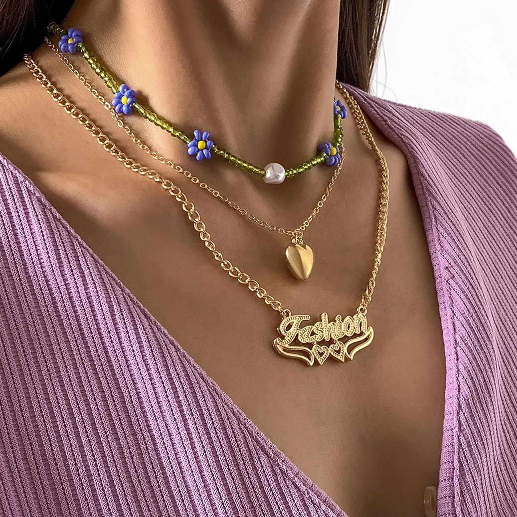 Vintage Little Daisy Flower Rice Bead Metal Letter Pendant Stacked Band Necklace
Vintage Little Daisy Flower Rice Bead Metal Letter Pendant Stacked Band Necklace