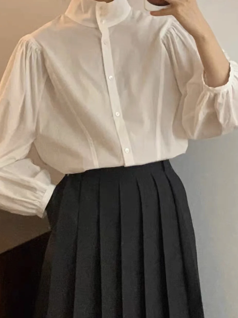 Модная ретро-рубашка с воротником-стойкой и рукавами-фонариками в корейском стиле Dongdaemun, прямого кроя, с длинными рукавами, для повседневной носки
Модная ретро-рубашка с воротником-стойкой и рукавами-фонариками в корейском стиле Dongdaemun, прямого кроя, с длинными рукавами, для повседневной носки