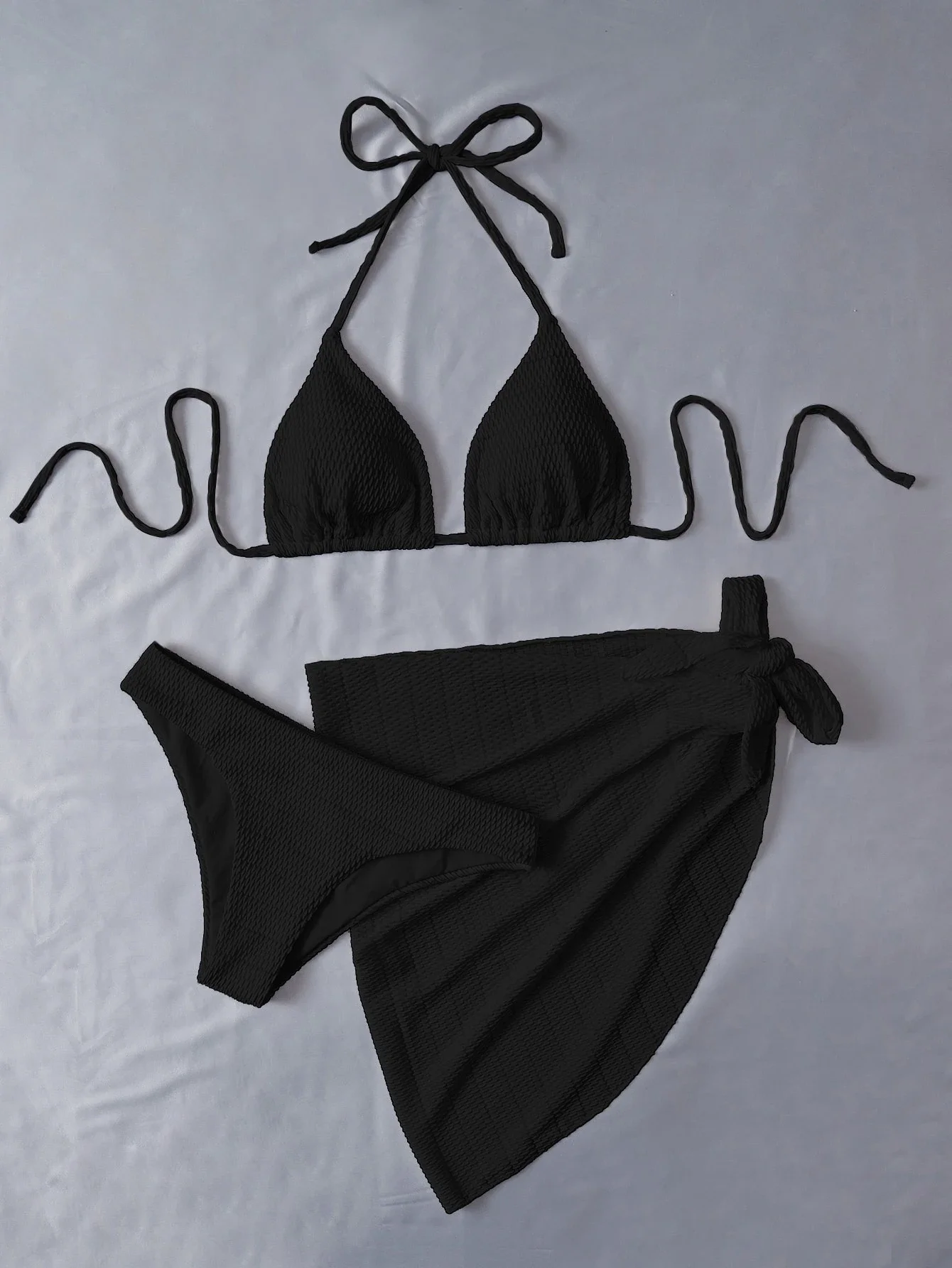Black Textured Triangle Halter Bikini With Wrap Skirt For Beach Vacation
Black Textured Triangle Halter Bikini With Wrap Skirt For Beach Vacation