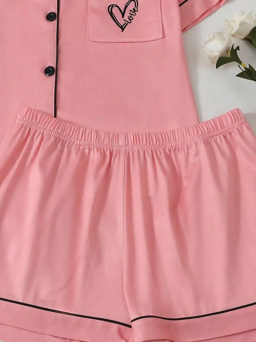 Womens Pink Solid Pajama Set Short Sleeve Button Up Top With Heart Embroidery Elastic Waist Shorts Loungewear
Womens Pink Solid Pajama Set Short Sleeve Button Up Top With Heart Embroidery Elastic Waist Shorts Loungewear