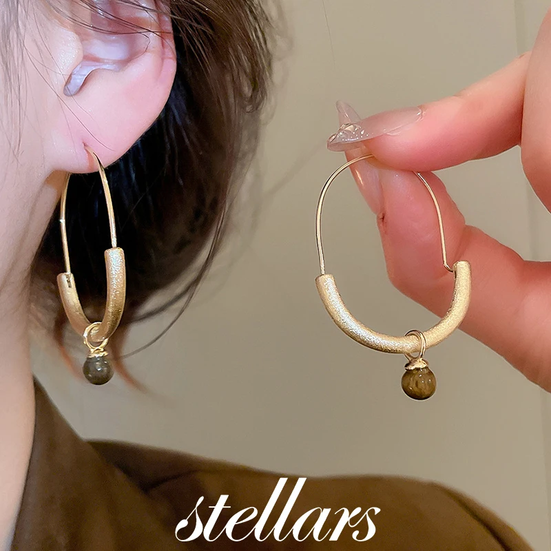 Design Niche European American Style Metal Tiger-eye Stone Hoop Earrings Retro Personality Fashion Temperament Versatile Earring
Design Niche European American Style Metal Tiger-eye Stone Hoop Earrings Retro Personality Fashion Temperament Versatile Earring