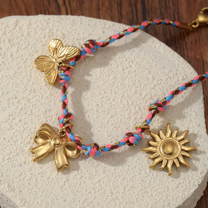 Golden Tone Braided Cord Charm Bracelet with Butterfly Bow and Sun Pendants for Women
Golden Tone Braided Cord Charm Bracelet with Butterfly Bow and Sun Pendants for Women