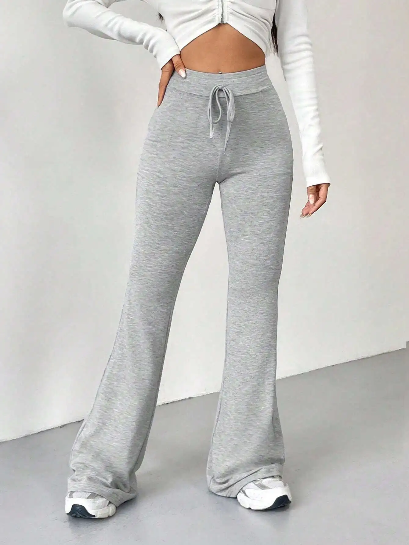 High-Waisted Grey Flare Leg Sweatpants with Drawstring Waist
High-Waisted Grey Flare Leg Sweatpants with Drawstring Waist
