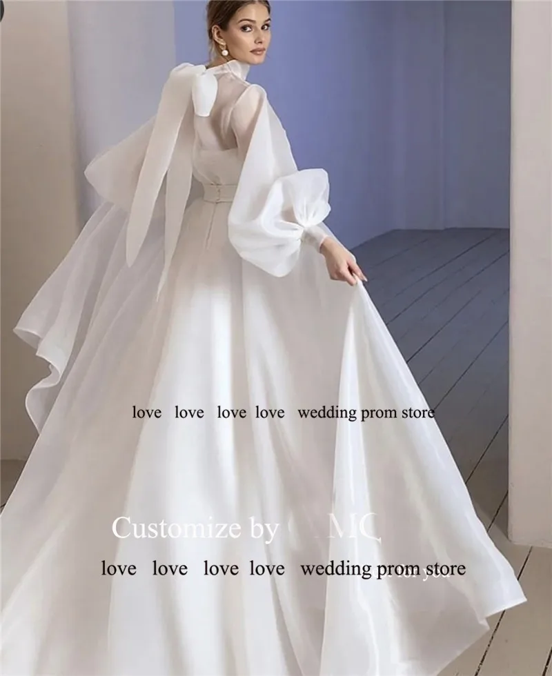 OLOEY Простые корейские свадебные платья трапециевидной формы Скромные пышные длинные рукава с высоким воротом из шелка и органзы Простые свадебные платья с бантом на спине
OLOEY Простые корейские свадебные платья трапециевидной формы Скромные пышные длинные рукава с высоким воротом из шелка и органзы Простые свадебные платья с бантом на спине