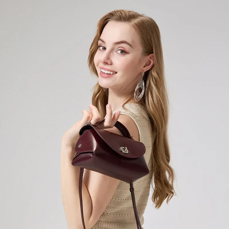 Genuine Cowhide Leather Mini Flap Crossbody Bag for Women Luxury Designer Smooth Leather Top Handle Bag with Twist Lock Closure
Genuine Cowhide Leather Mini Flap Crossbody Bag for Women Luxury Designer Smooth Leather Top Handle Bag with Twist Lock Closure