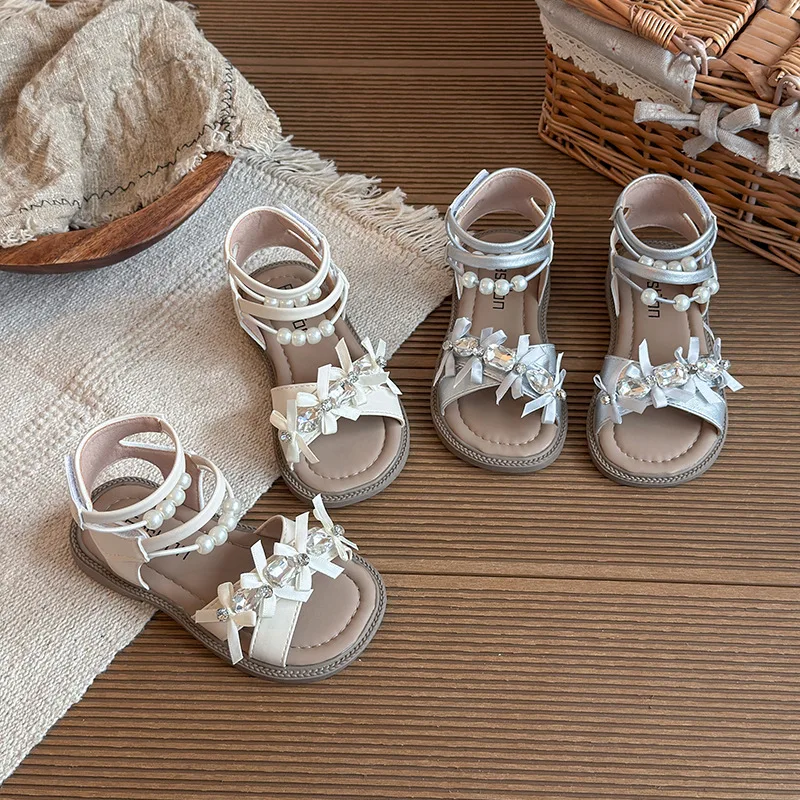 Girls Sandals Elegant Pearl Children Roman Shoes Korean Style Versatile 2026 Summer New Kids Princess Shoes Soft Bottom Non-slip
Girls Sandals Elegant Pearl Children Roman Shoes Korean Style Versatile 2026 Summer New Kids Princess Shoes Soft Bottom Non-slip